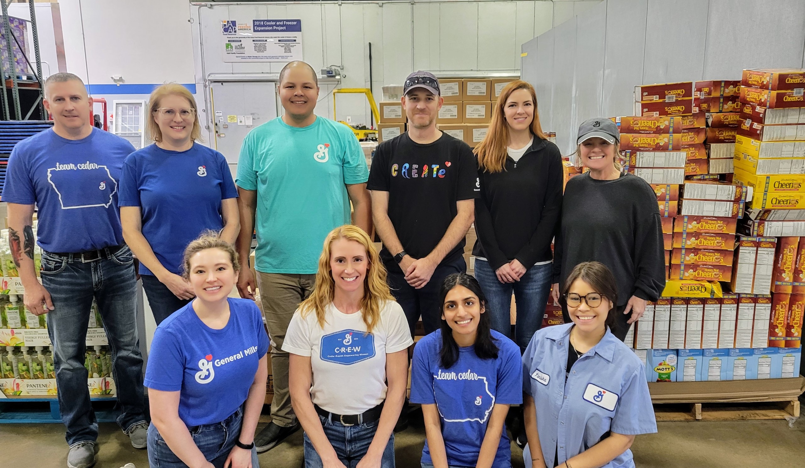 General Mills employees helping pack food donations for people facing hunger.